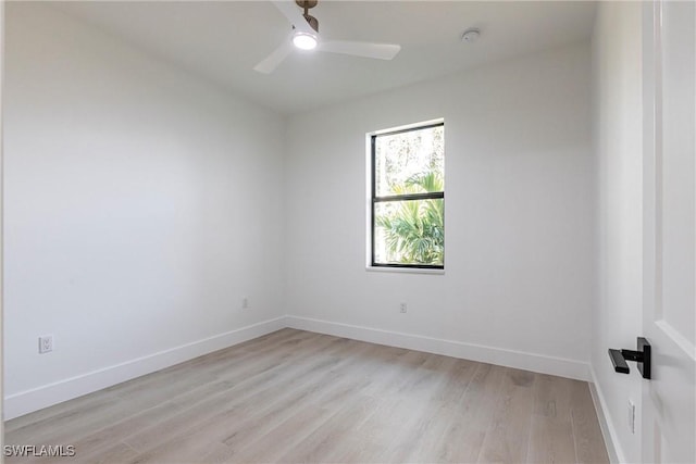 empty room with ceiling fan and light hardwood / wood-style flooring