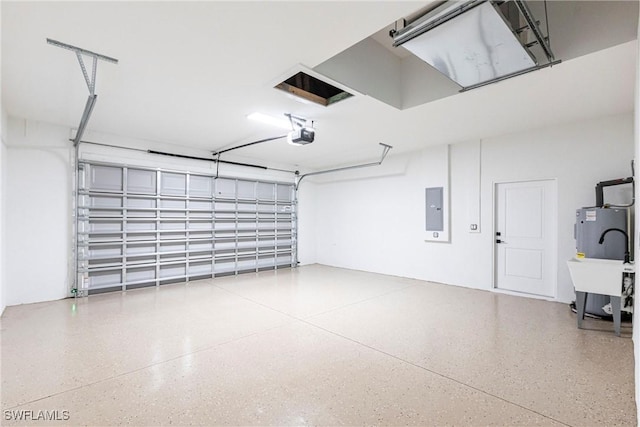 garage with a garage door opener, electric panel, and electric water heater