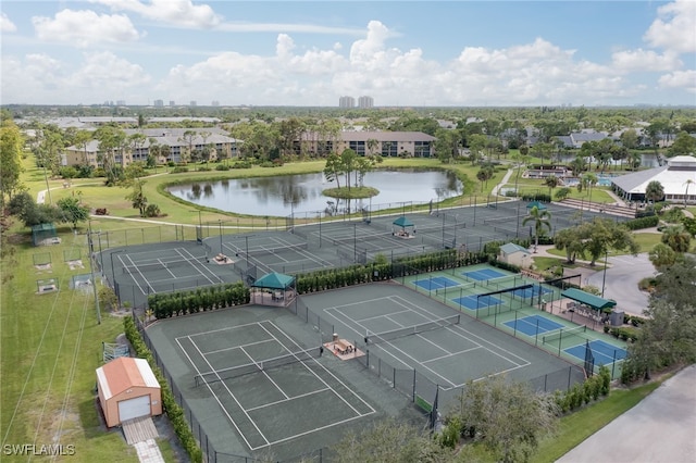 birds eye view of property with a water view