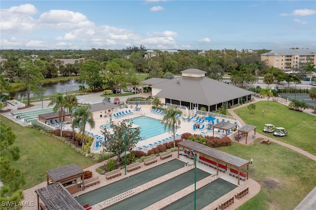 birds eye view of property with a water view