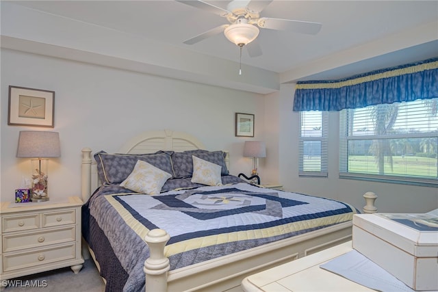 bedroom with ceiling fan and carpet flooring