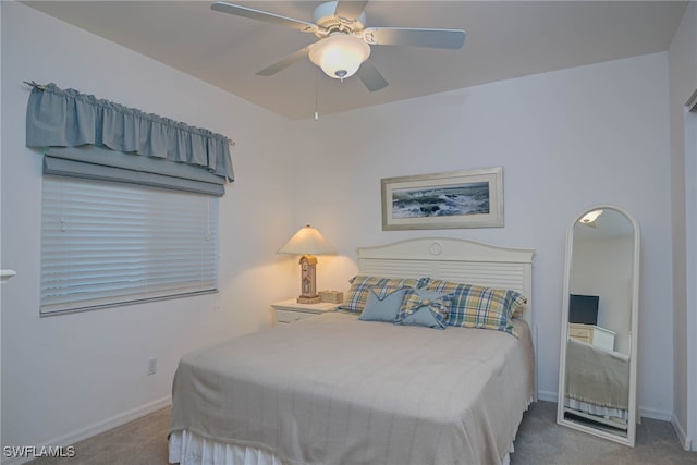 bedroom with ceiling fan and carpet flooring