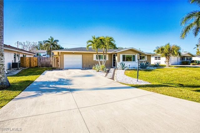 single story home featuring central AC, a garage, and a front yard