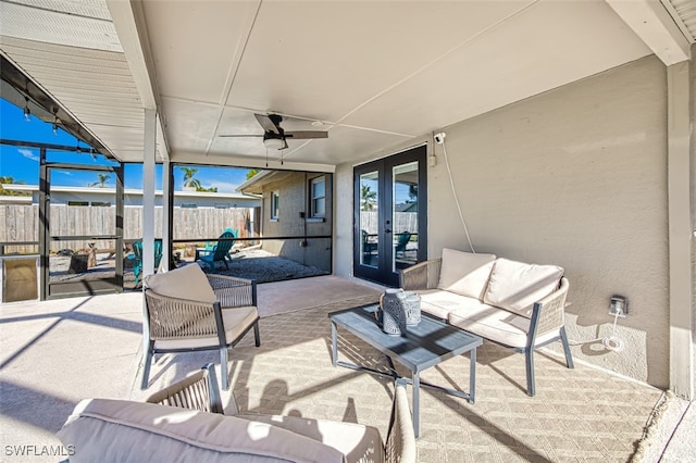 view of patio featuring outdoor lounge area, ceiling fan, and french doors