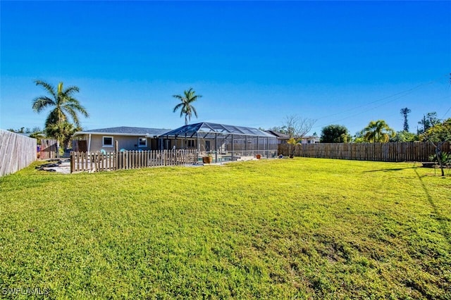 view of yard featuring a lanai