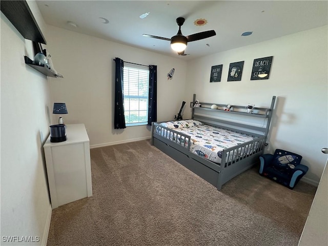 carpeted bedroom featuring ceiling fan