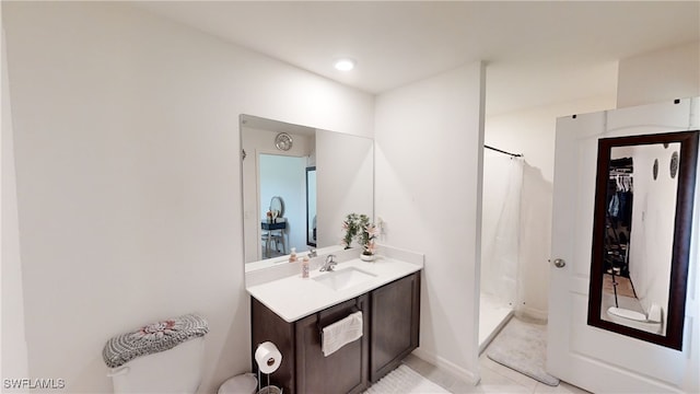 bathroom featuring vanity and walk in shower