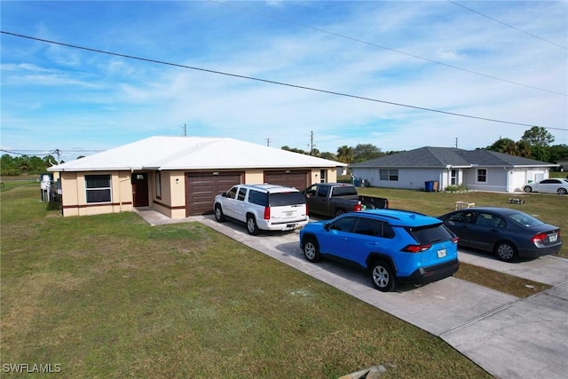 ranch-style house featuring a garage and a front yard