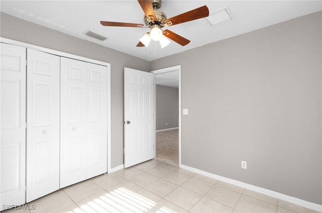 unfurnished bedroom featuring a closet, ceiling fan, and light tile patterned flooring