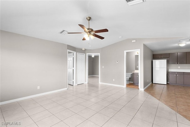 interior space with vaulted ceiling and ceiling fan