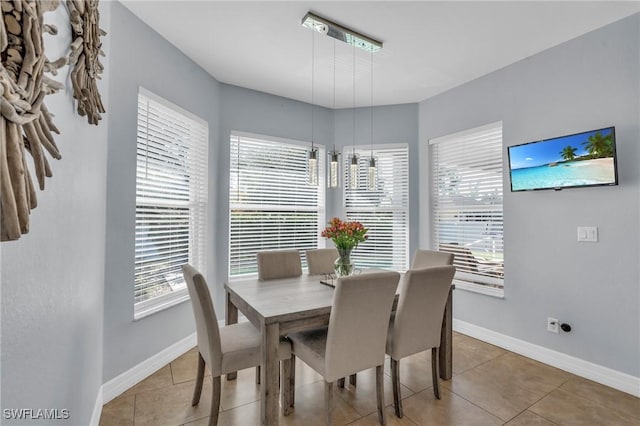 dining area featuring plenty of natural light and tile patterned flooring