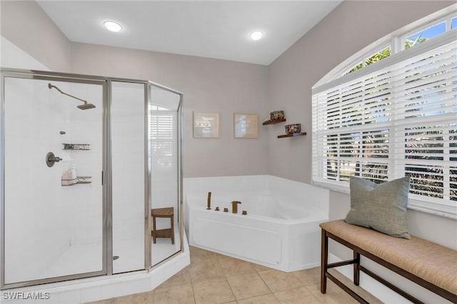 bathroom with tile patterned flooring and independent shower and bath