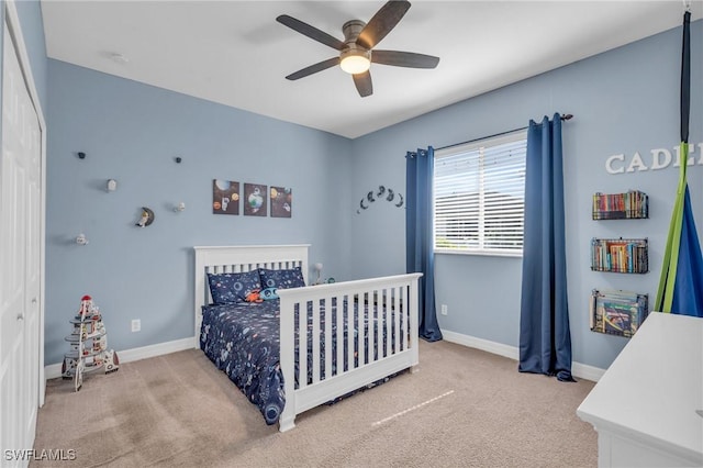 carpeted bedroom featuring ceiling fan