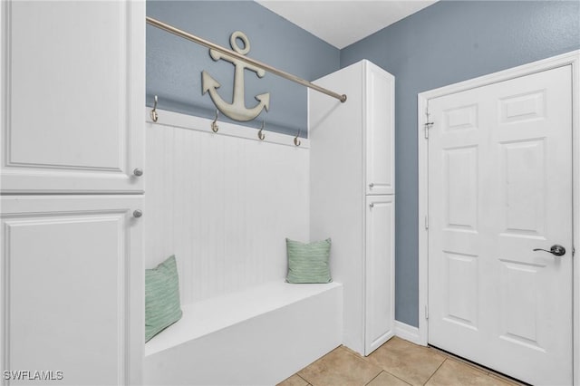 mudroom with light tile patterned flooring