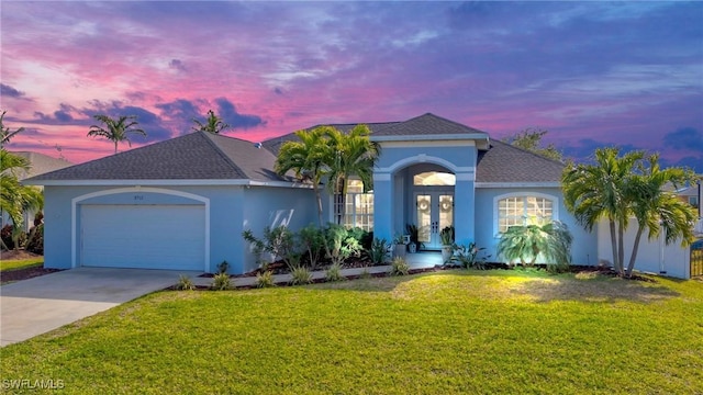 3712 SW 2nd Ln, Cape Coral, FL 33991 - view of front facade featuring a garage and a lawn