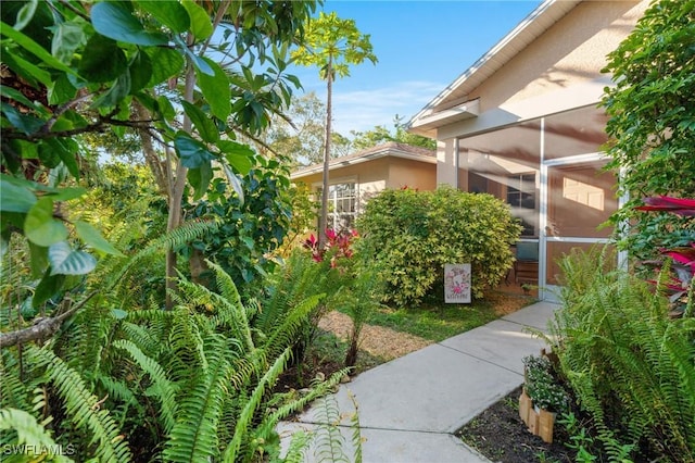 exterior space with a sunroom