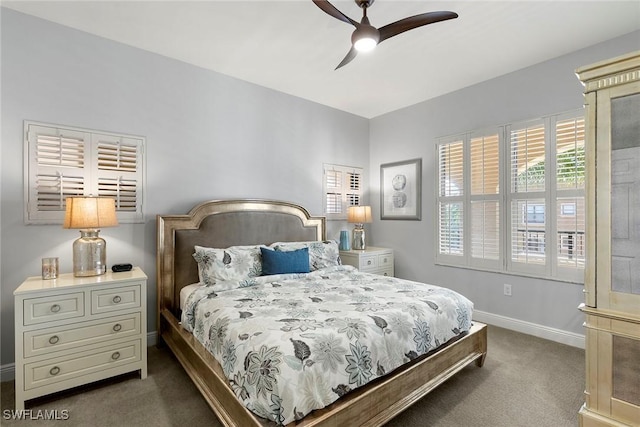 bedroom with dark carpet and ceiling fan