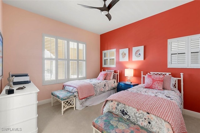 carpeted bedroom featuring ceiling fan