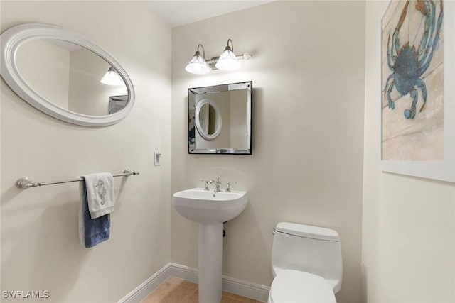 bathroom with sink and toilet