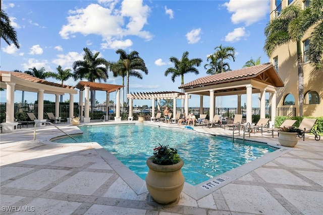 view of pool with a pergola and a patio