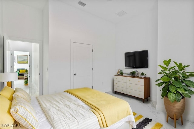 bedroom with a towering ceiling