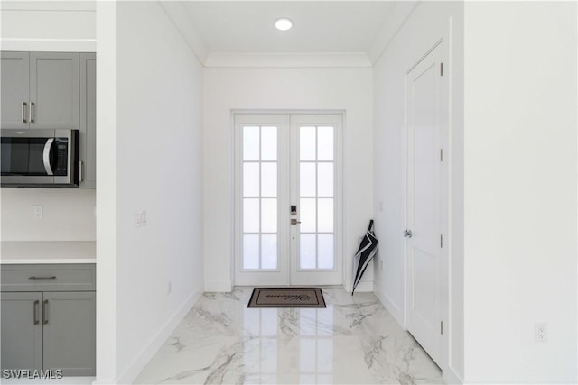 doorway with french doors and ornamental molding