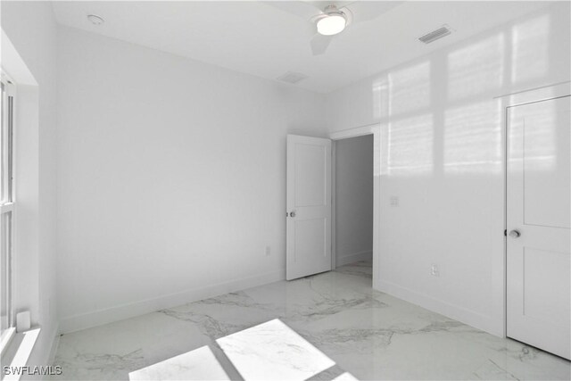 unfurnished bedroom featuring ceiling fan