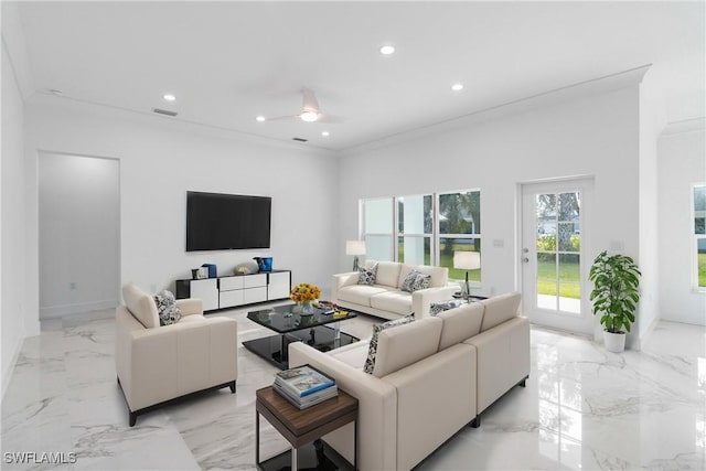 living room featuring crown molding