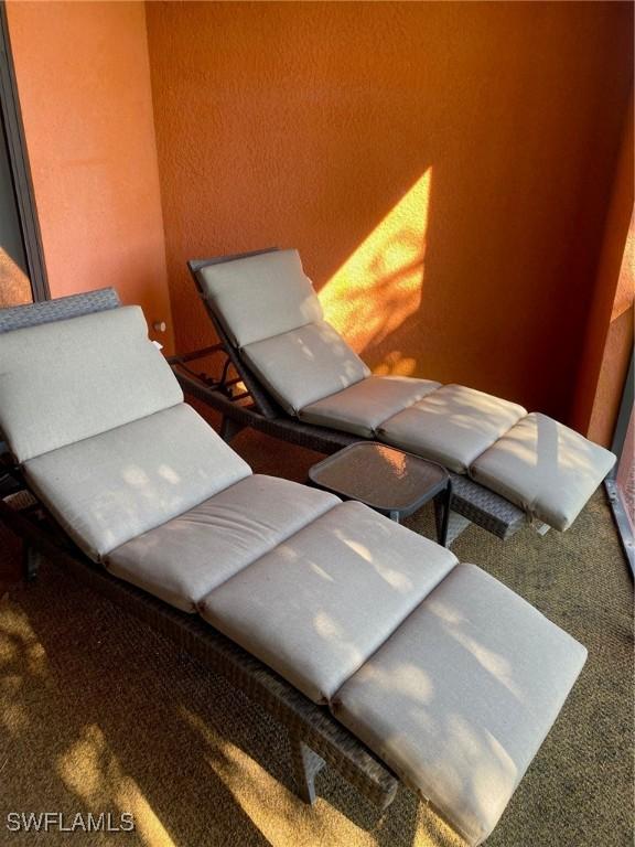 living area featuring carpet flooring