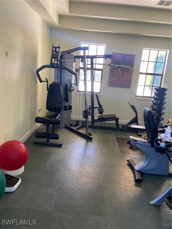 workout room with visible vents and baseboards