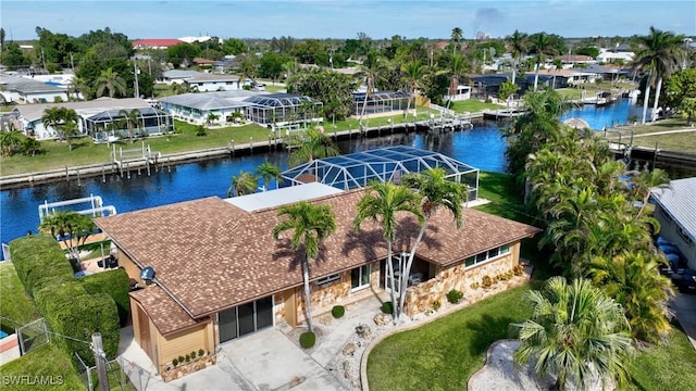 birds eye view of property featuring a water view and a residential view