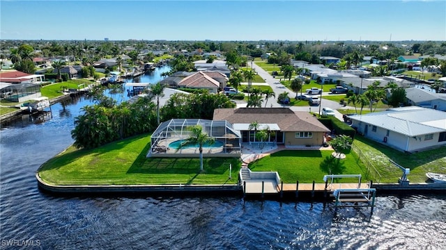 bird's eye view featuring a water view and a residential view