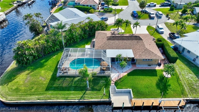 birds eye view of property with a residential view and a water view