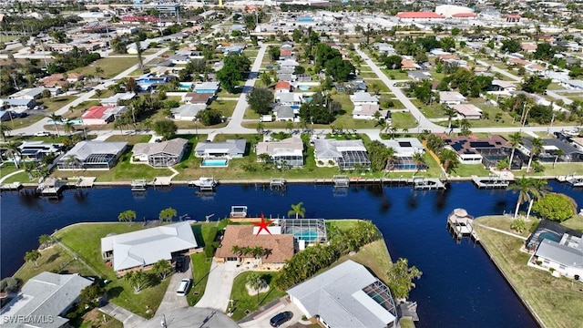 aerial view featuring a water view and a residential view