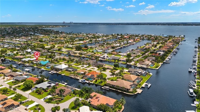 birds eye view of property featuring a water view