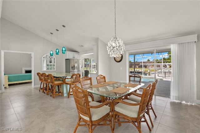 dining space with high vaulted ceiling, light tile patterned floors, and a notable chandelier