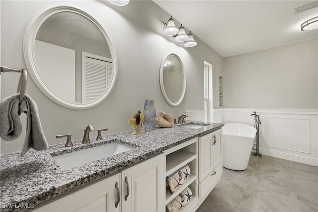 bathroom featuring a bathing tub and vanity