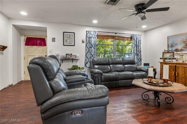 living room featuring dark hardwood / wood-style flooring and ceiling fan