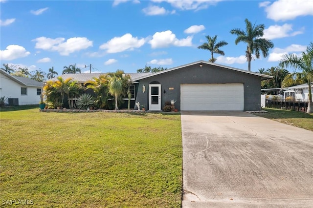 view of front of property featuring a garage and a front lawn