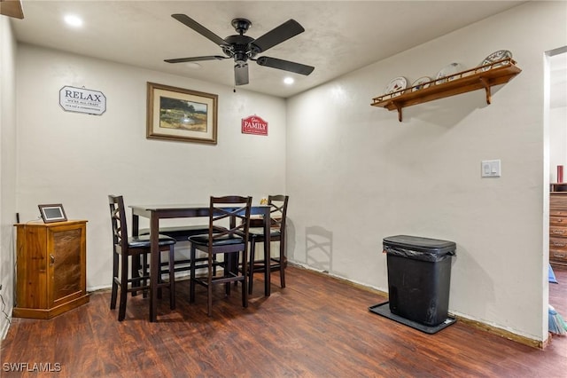 dining room featuring dark hardwood / wood-style flooring and ceiling fan