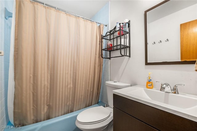 full bathroom featuring shower / tub combo, vanity, and toilet