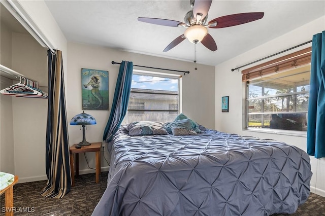 carpeted bedroom featuring ceiling fan