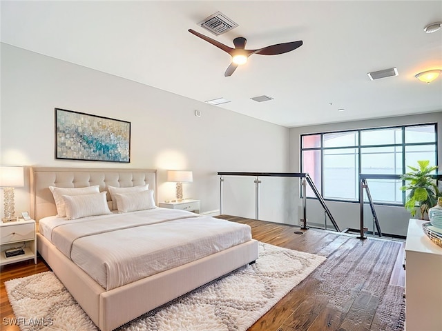 bedroom with hardwood / wood-style flooring and ceiling fan