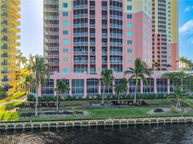 view of building exterior with a water view