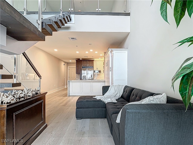 living room with light hardwood / wood-style floors