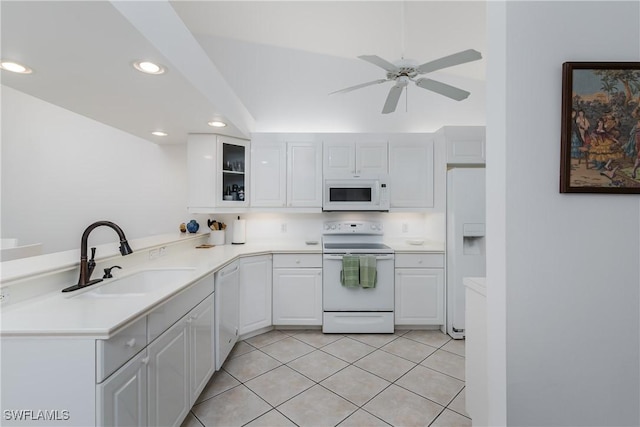 kitchen featuring white cabinetry, sink, light tile patterned floors, ceiling fan, and white appliances