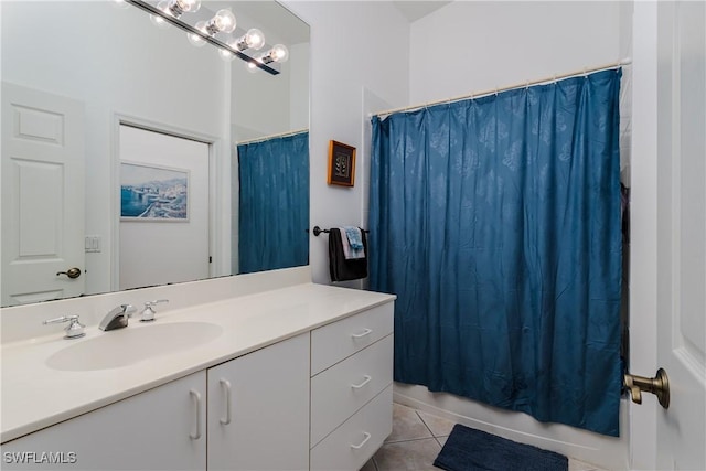 bathroom with tile patterned floors and vanity