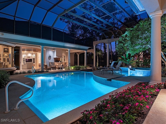 view of swimming pool featuring a lanai and a patio