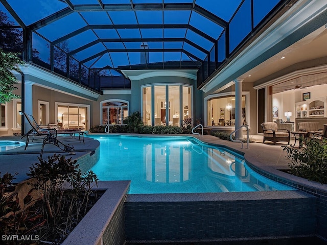 view of swimming pool featuring a patio, a lanai, and outdoor lounge area