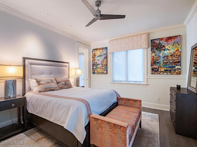 bedroom with a wainscoted wall, a ceiling fan, wood finished floors, and crown molding